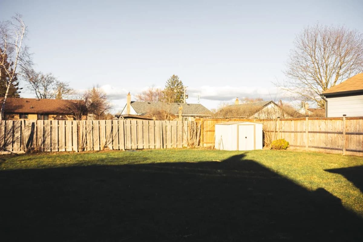 Residential backyard with a wood privacy fence
